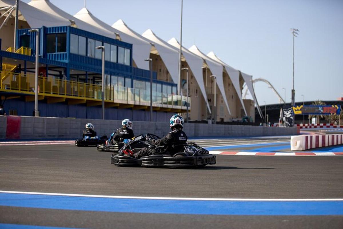 a group of people riding on trikes on a race track