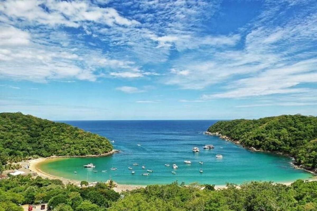 a view of a beach with boats in the water