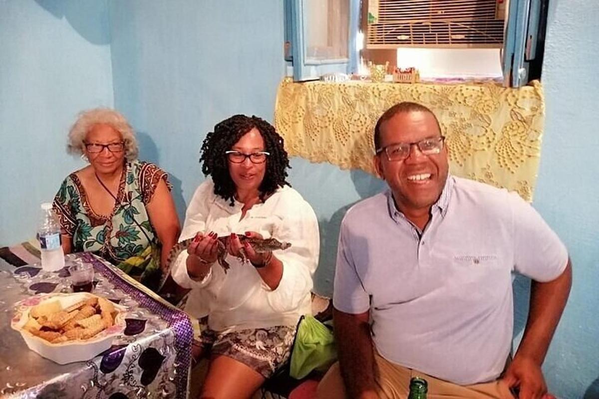 a man and two women sitting next to a table