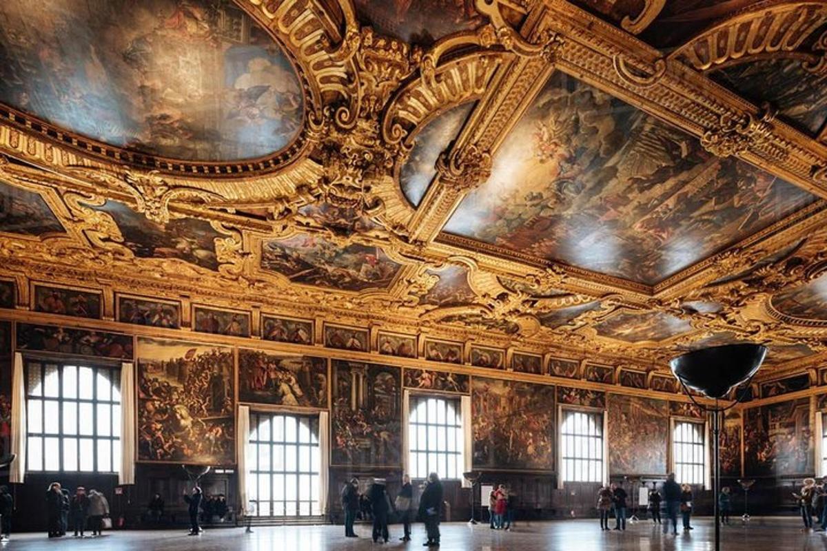 a room with paintings on the ceilings of a building