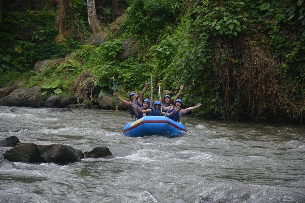 a group of people in a raft in a river