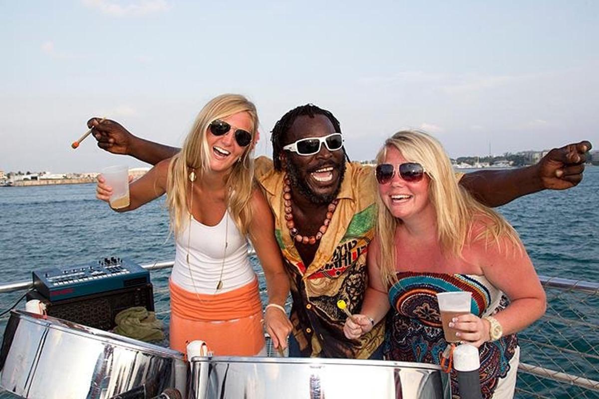 a group of three people standing on a boat