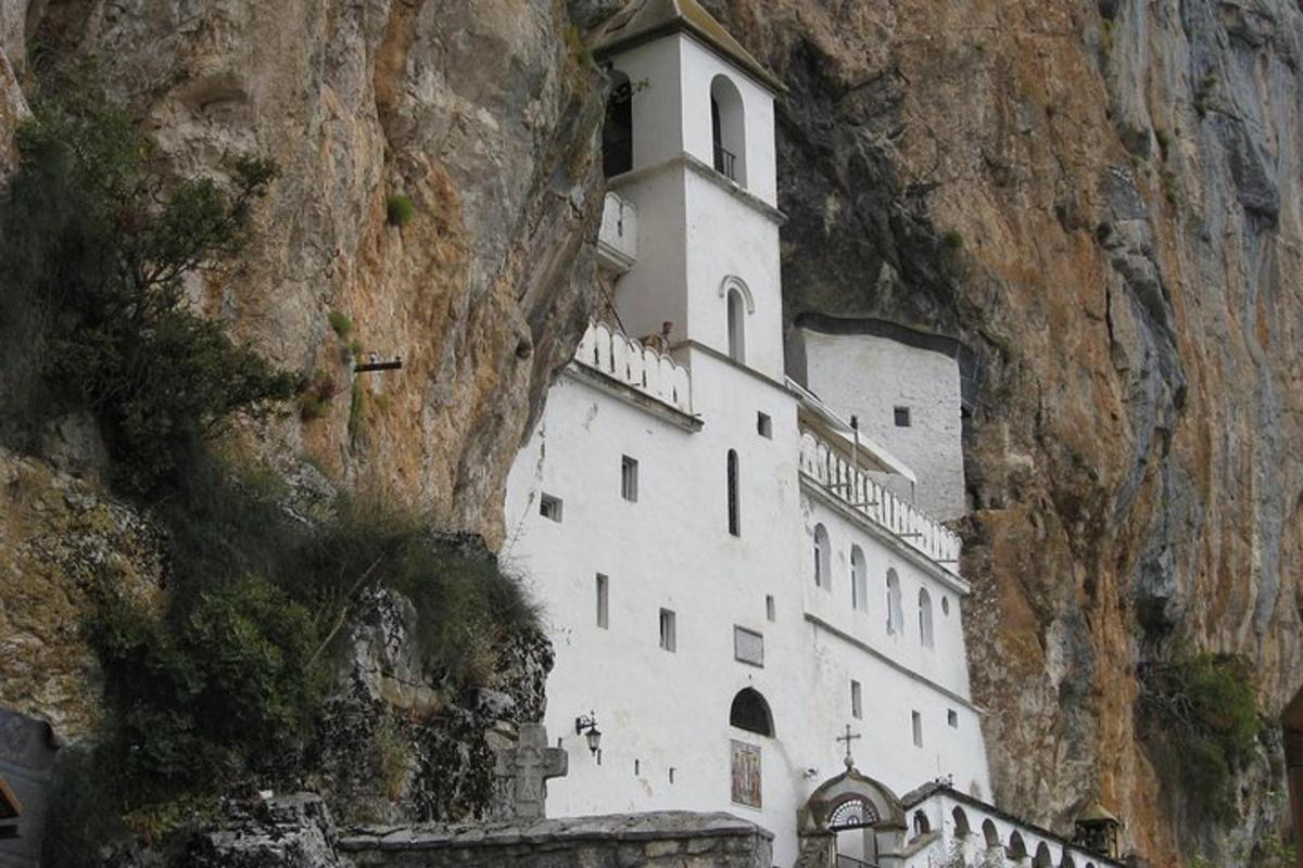 a white building on the side of a mountain