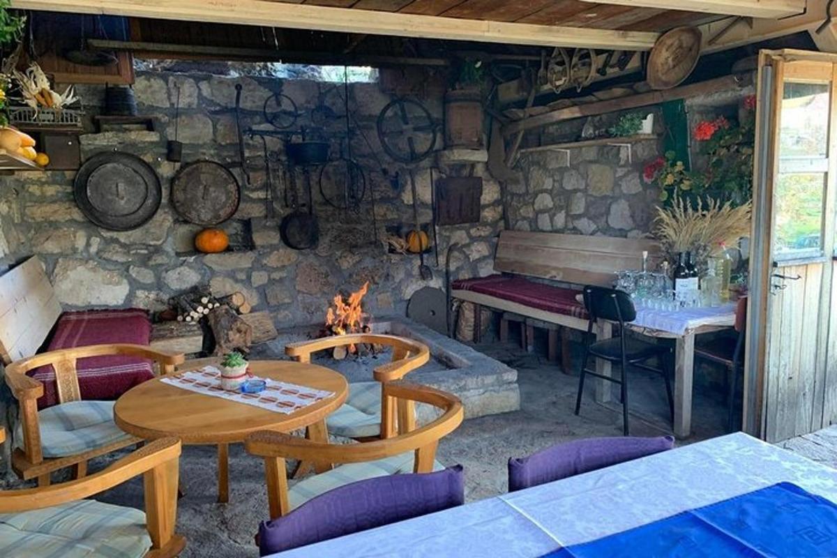 a room with a table and chairs and a fireplace