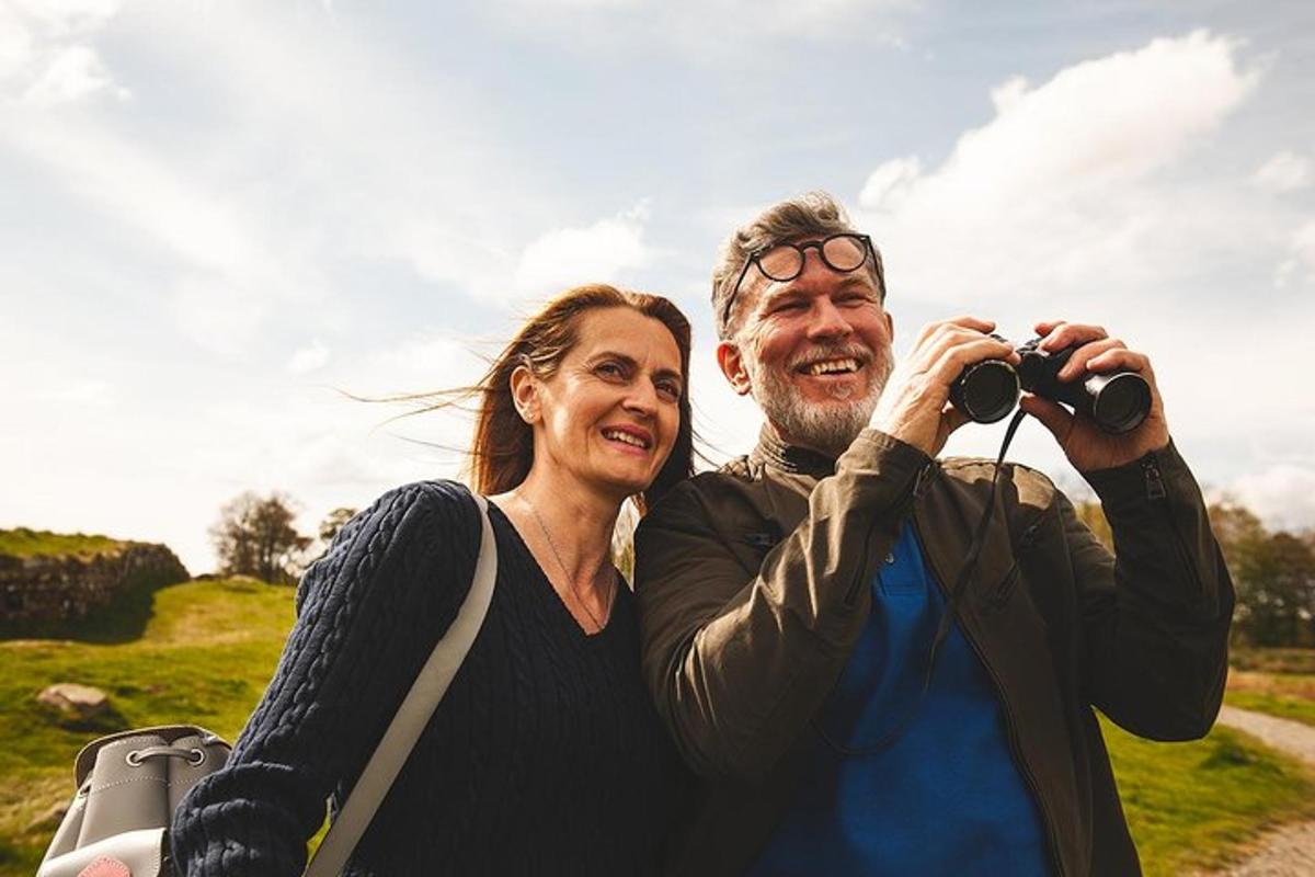 a man and woman taking a picture with a camera