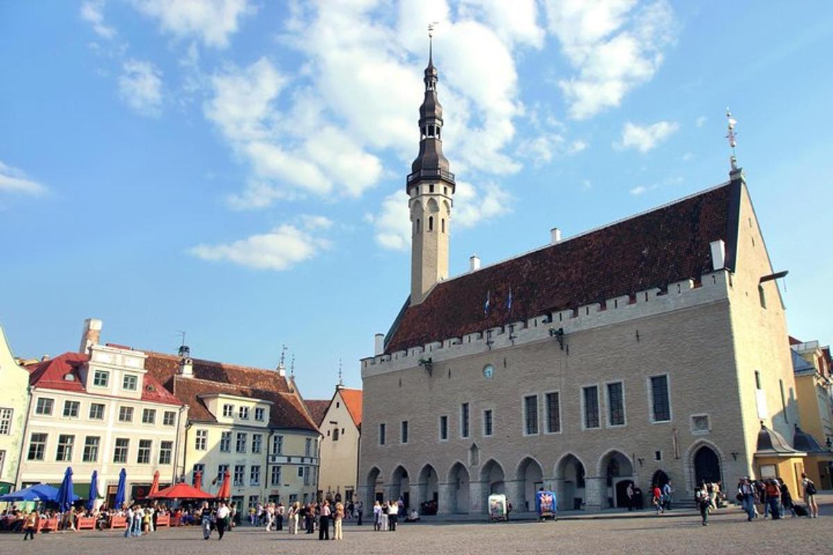a large building with a clock tower in a city