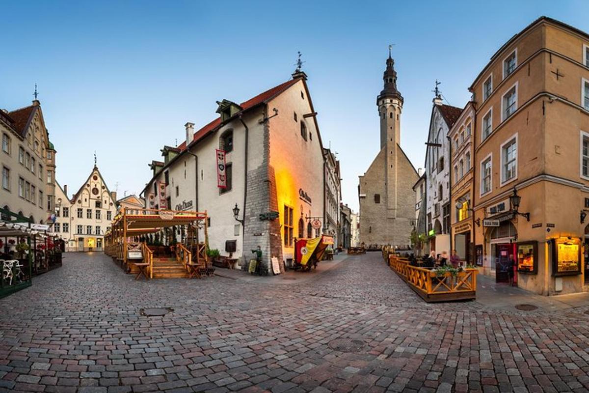 a city street with buildings and a clock tower
