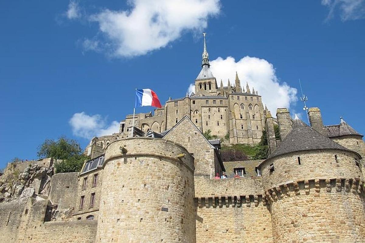a large castle with a building in the background