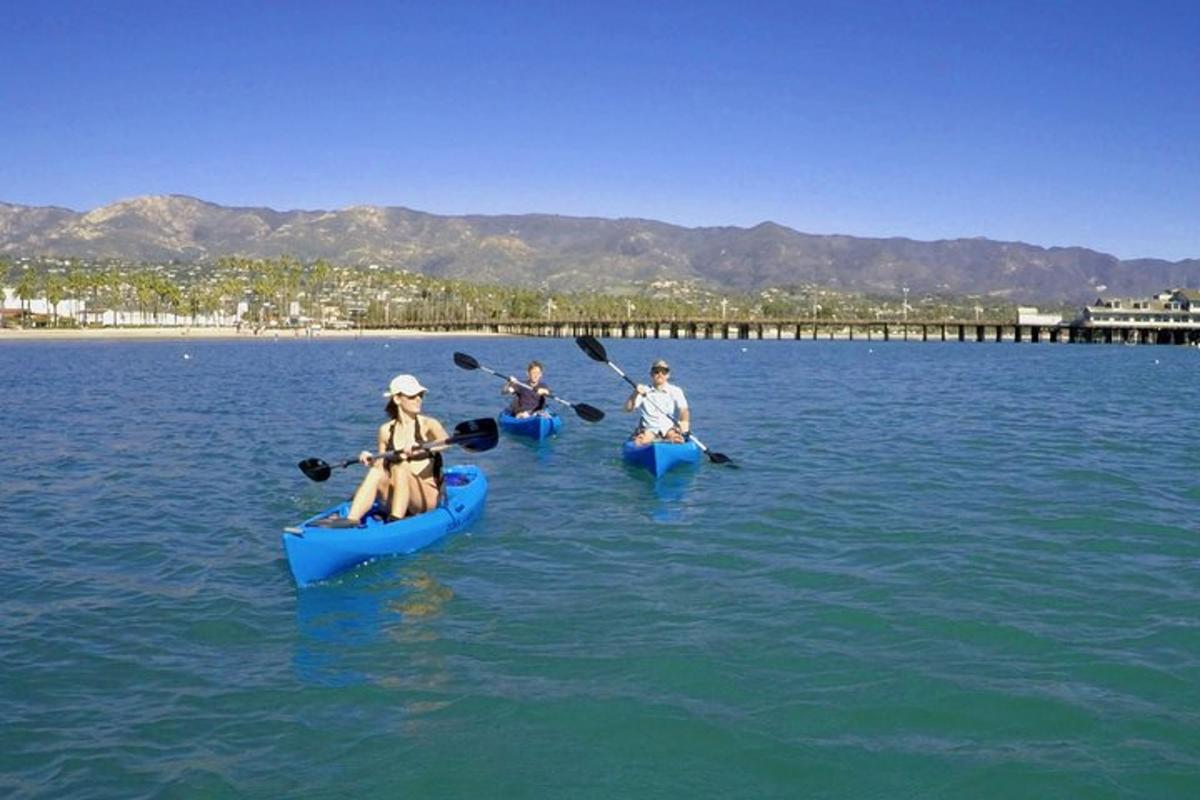 a group of people kayaking on a body of water