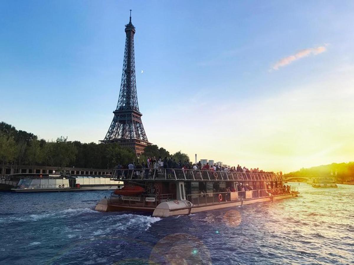 a tour boat in front of the eiffel tower