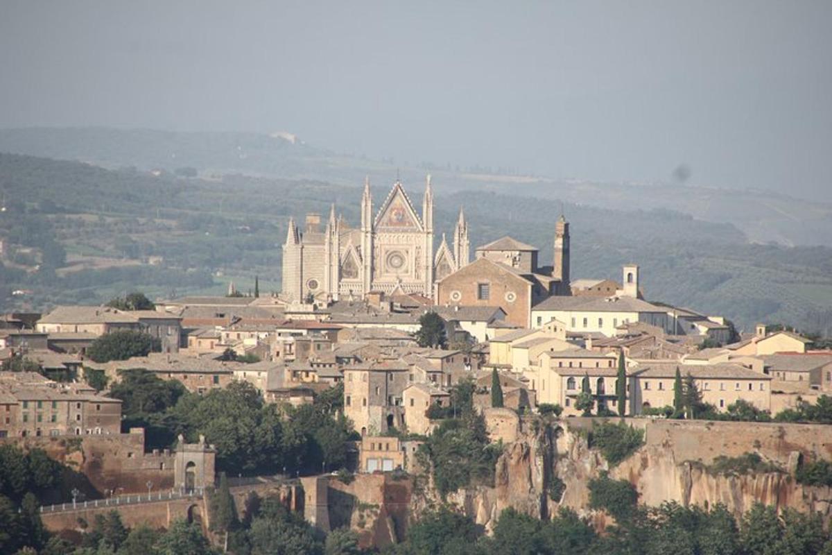 a town on top of a hill with a church