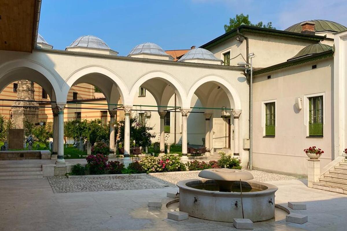 a building with a fountain in the middle of a courtyard