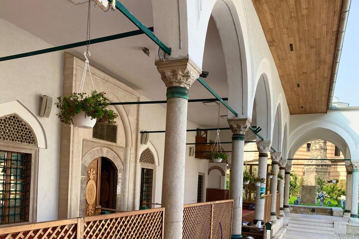 an empty building with columns and arches and a hallway