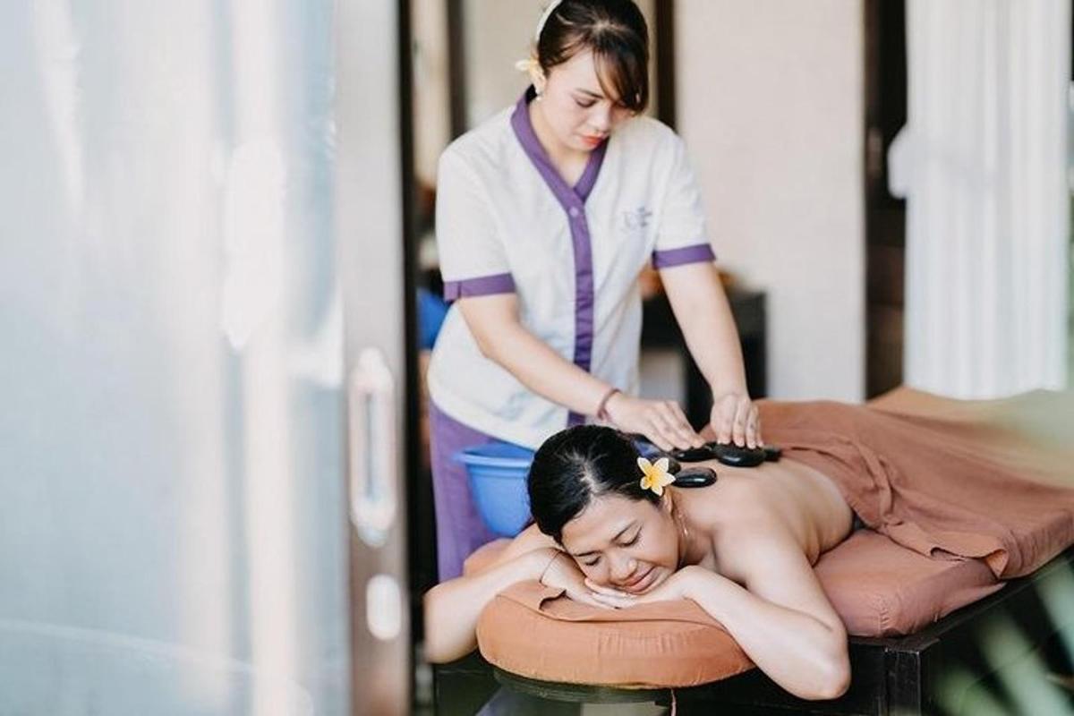 a woman getting her hair cut by a massage therapist