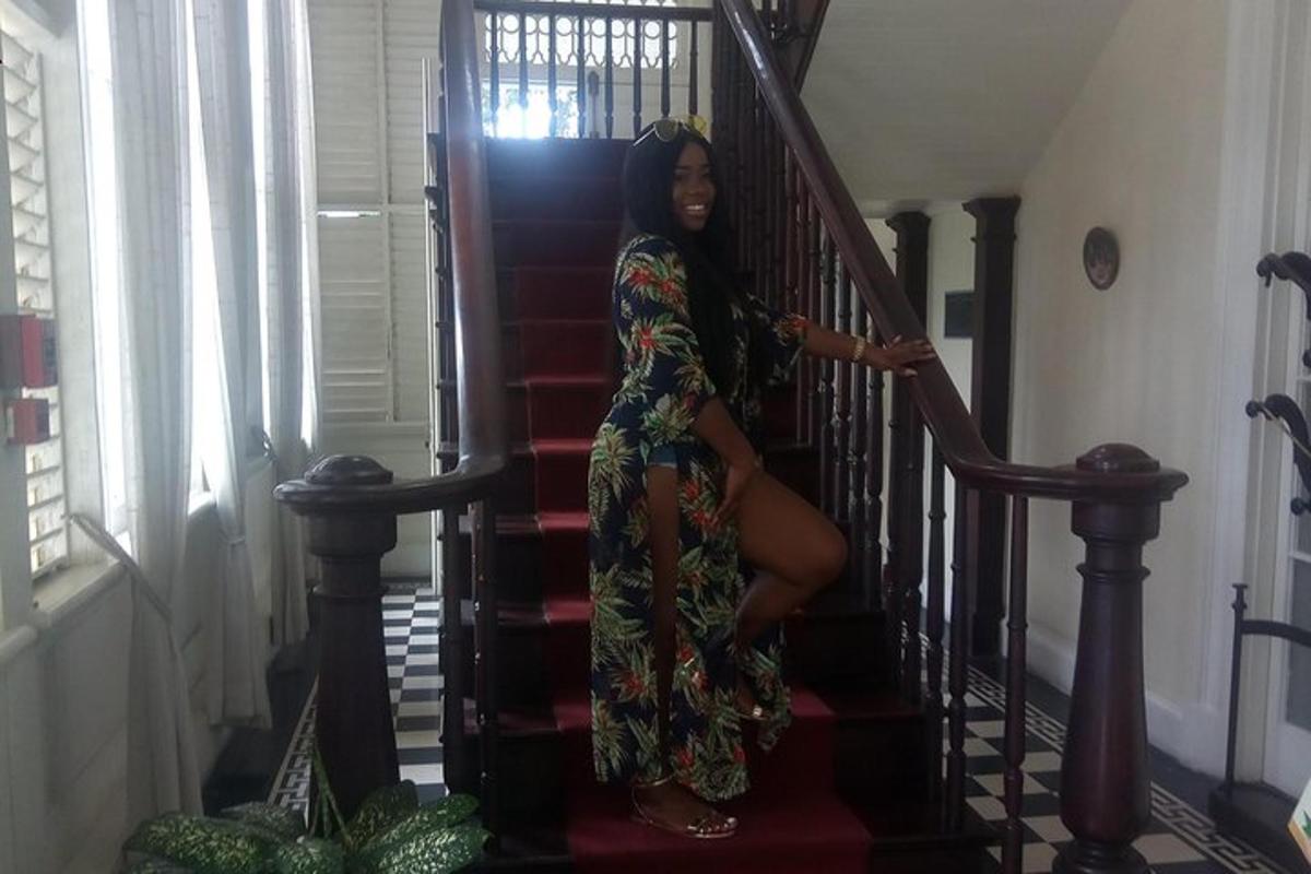 a woman in a dress sitting on the stairs