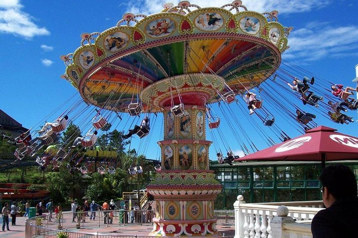 a ferris wheel at a carnival with people on it