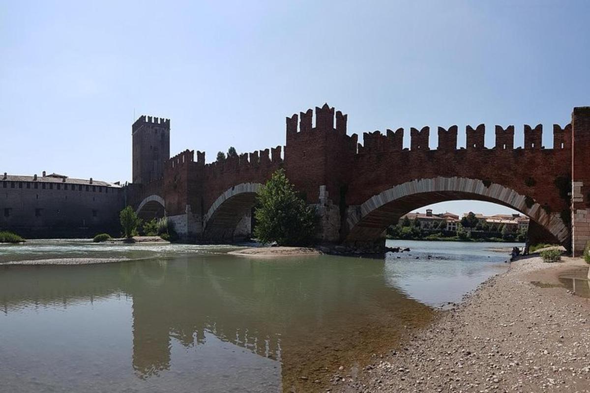 a bridge over a body of water with a castle