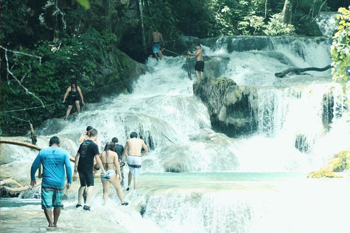 a group of people walking in a waterfall