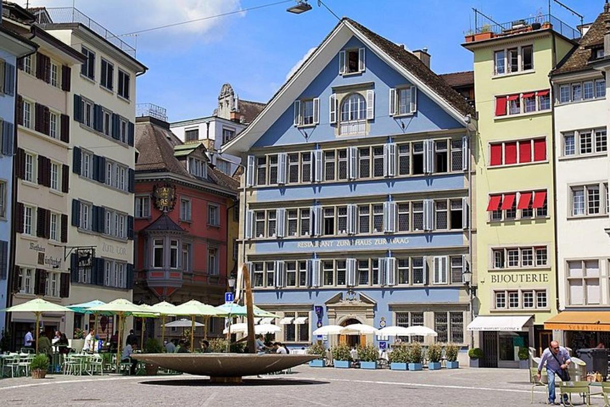a group of buildings with a fountain in front of them