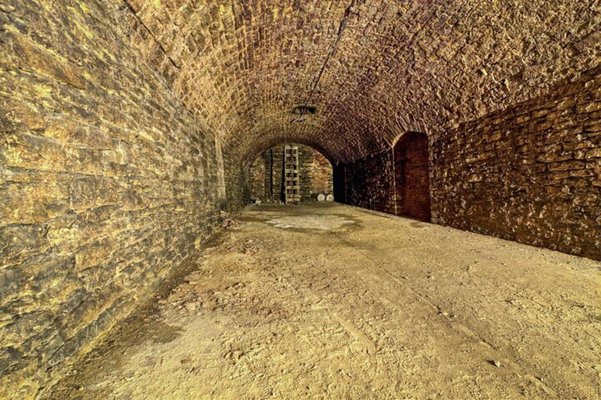 an old brick tunnel with a stone wall