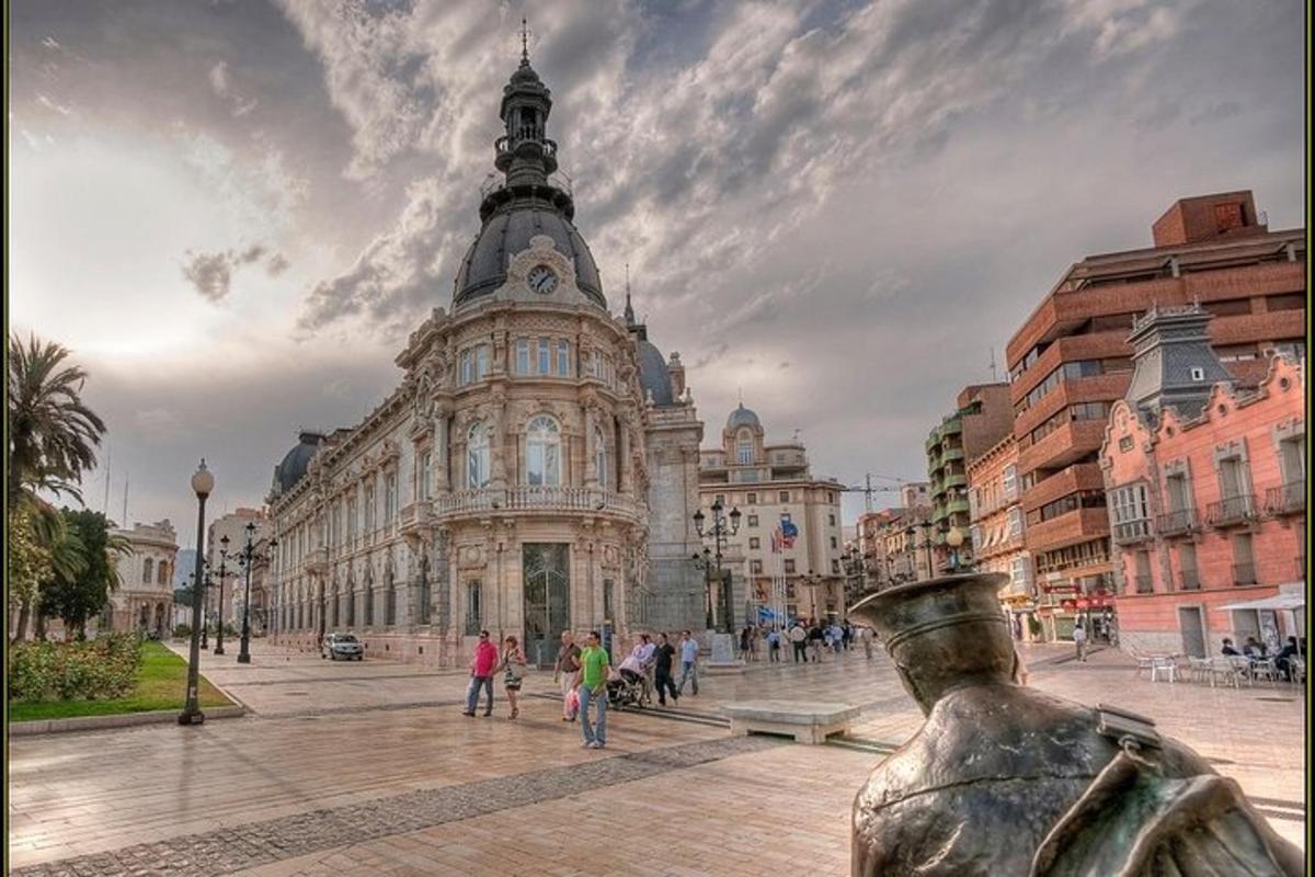 a large building with a statue in front of it