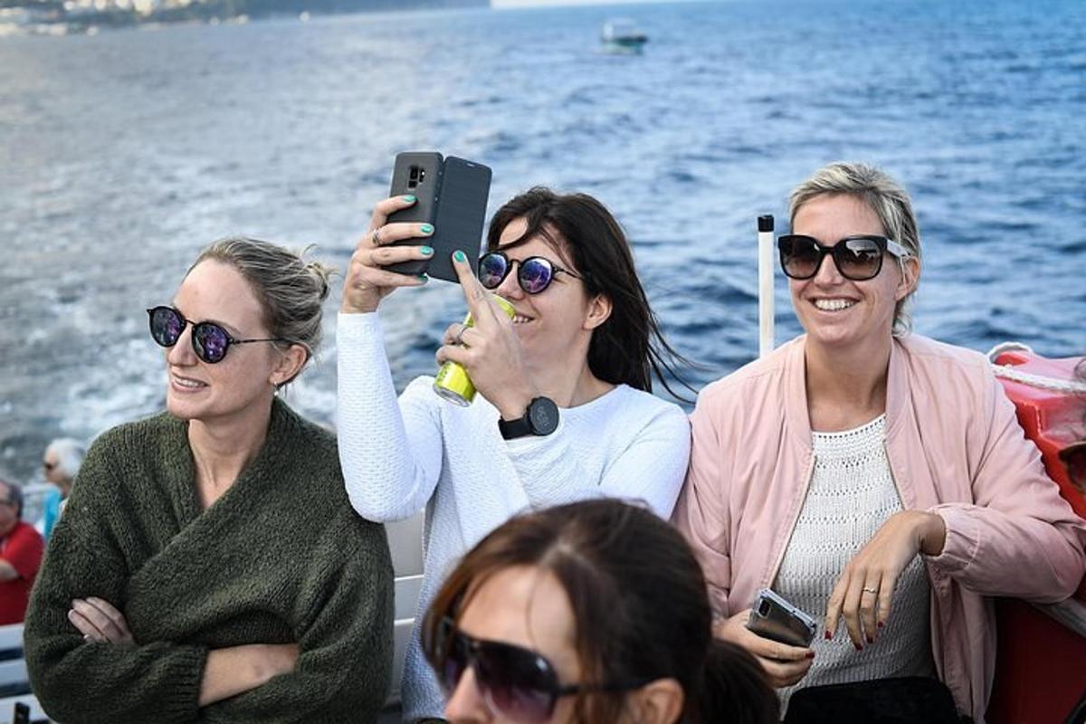 a group of women on a boat taking a picture