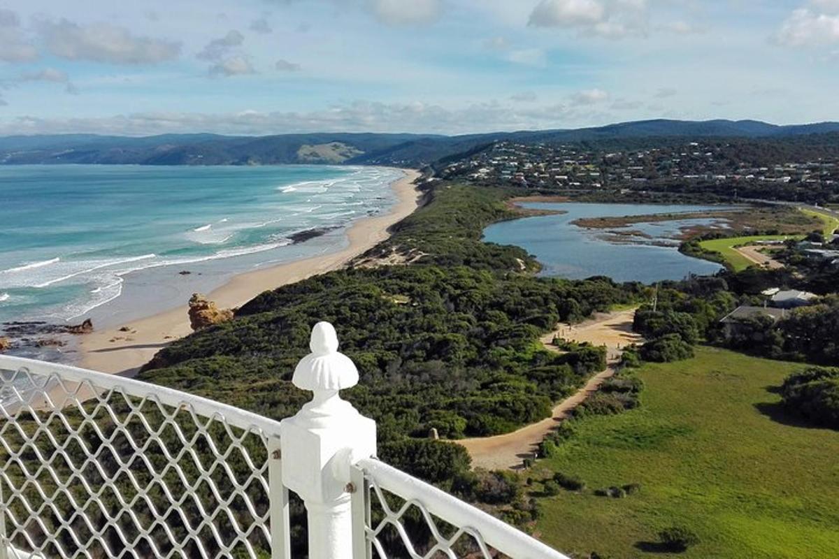 a view of the beach from the balcony of a lighthouse