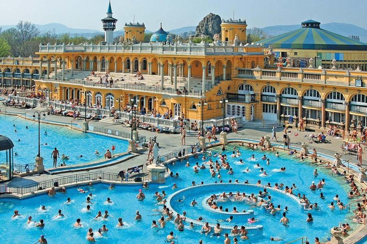 a large pool with people in it in front of a building