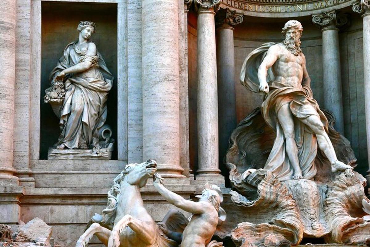 ένα σιντριβάνι με δύο αγάλματα μπροστά από ένα κτίριο