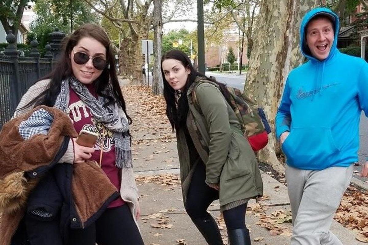 a group of people walking down the street