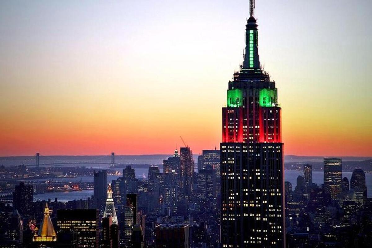 a view of the empire state building at sunset