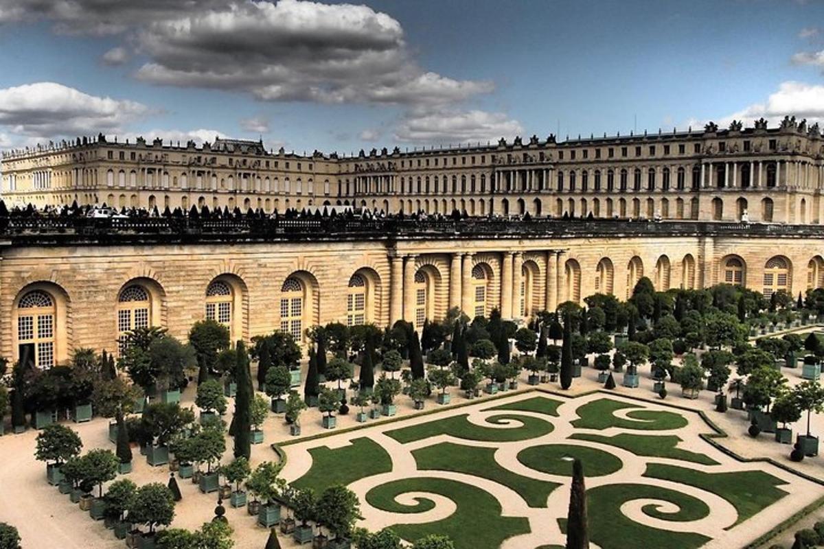 a large building with a garden in front of it