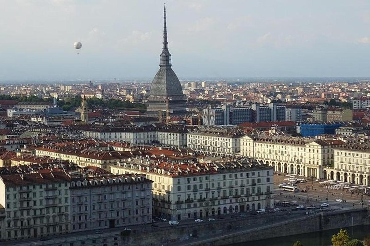 a view of a city with a tower and buildings