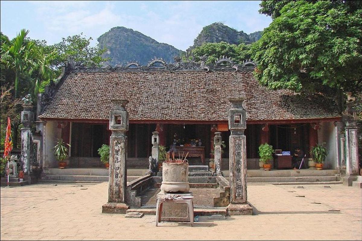 a building with a building with mountains in the background