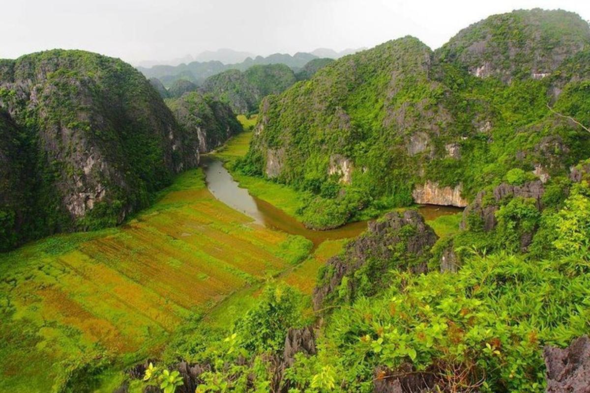 an aerial view of a river in a mountain valley