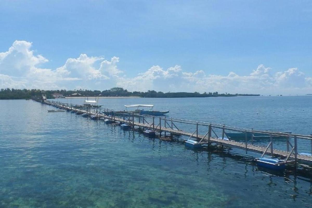 a dock in the water with boats on it