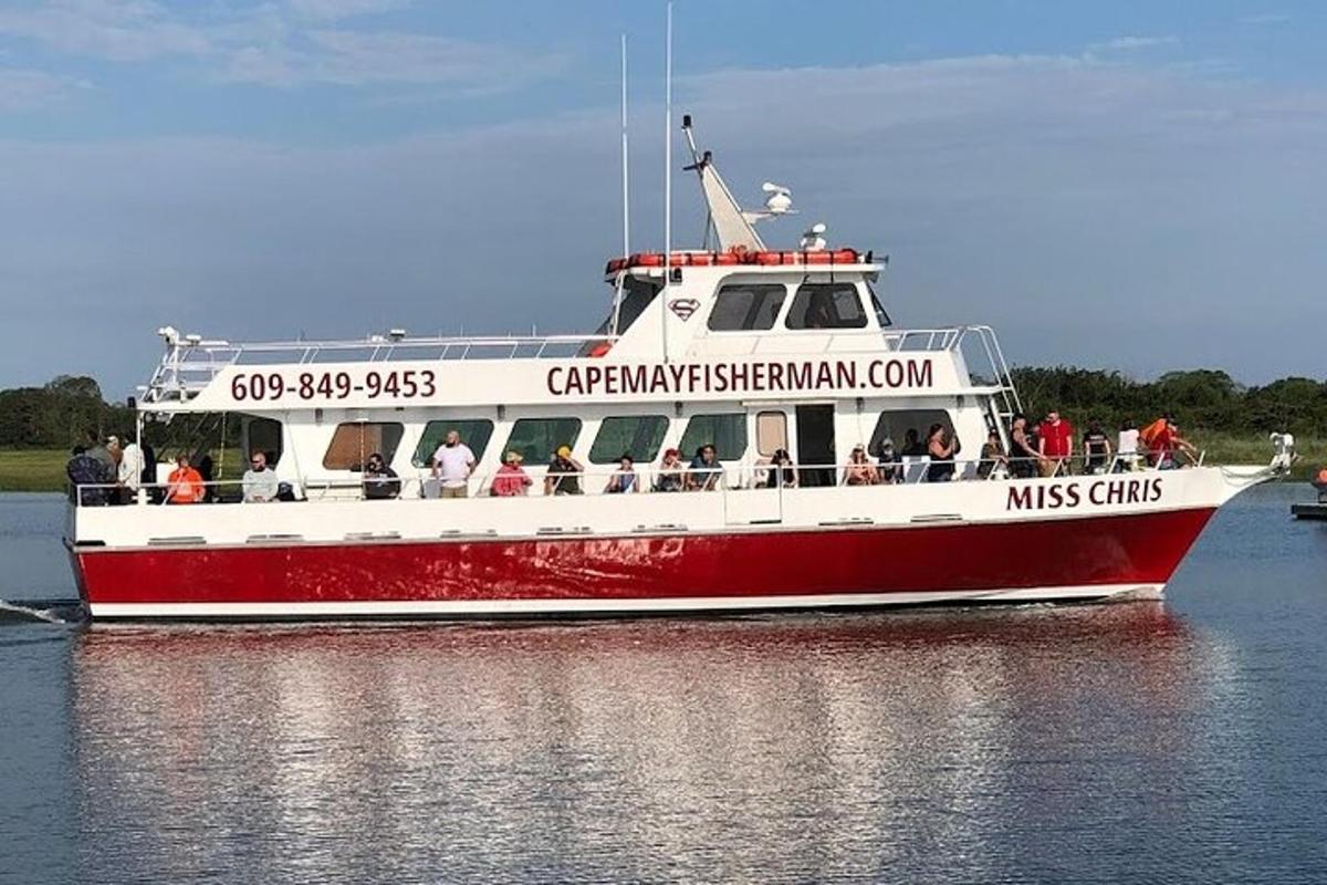 a red and white boat on the water