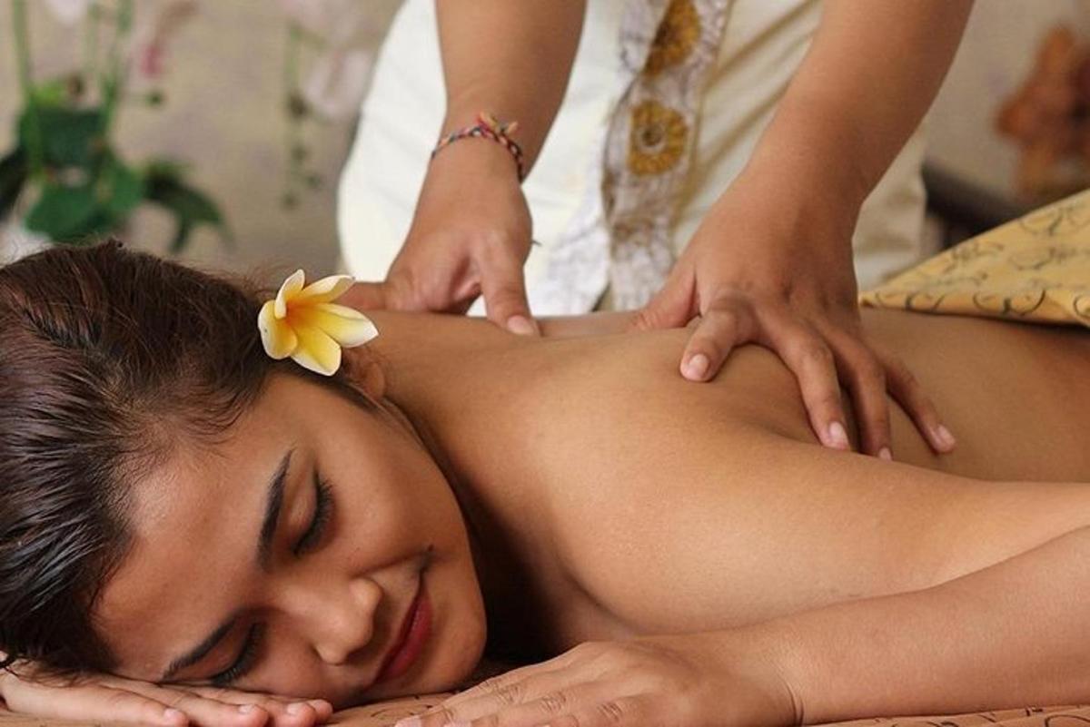 a woman getting a massage from a therapist