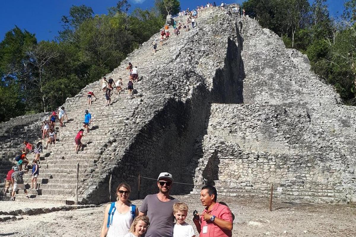 a group of people standing at the pyramid