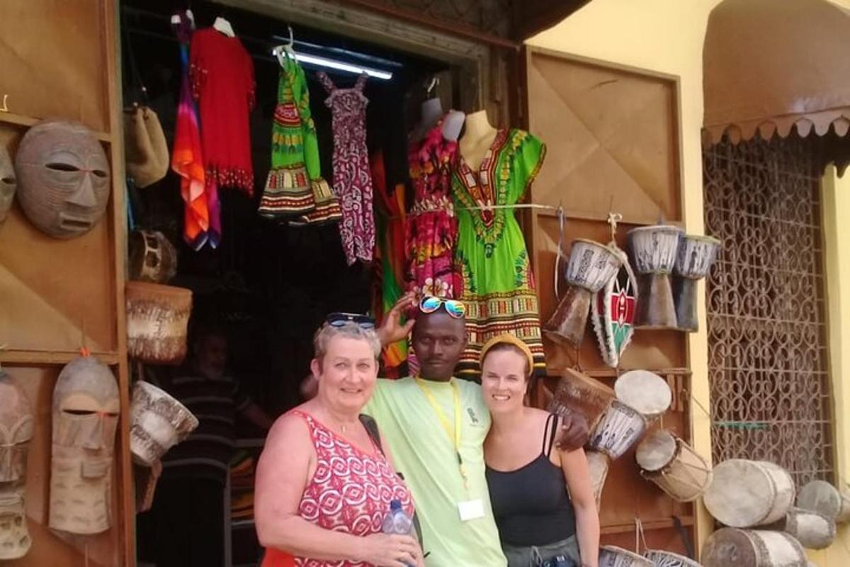 a man and two women standing in front of a store