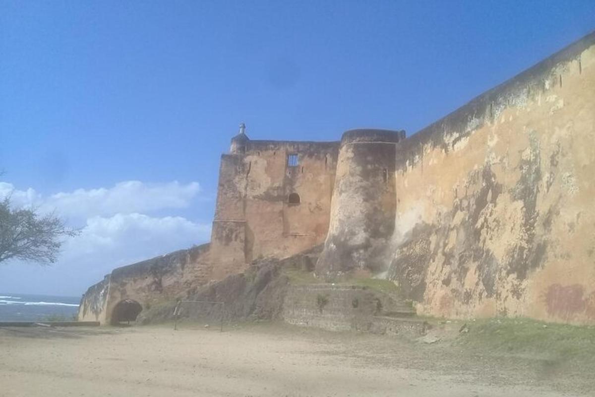 a castle on top of a cliff next to the ocean