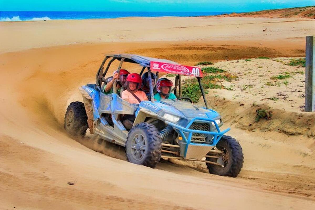 a group of people riding in a toyotaruck in the desert