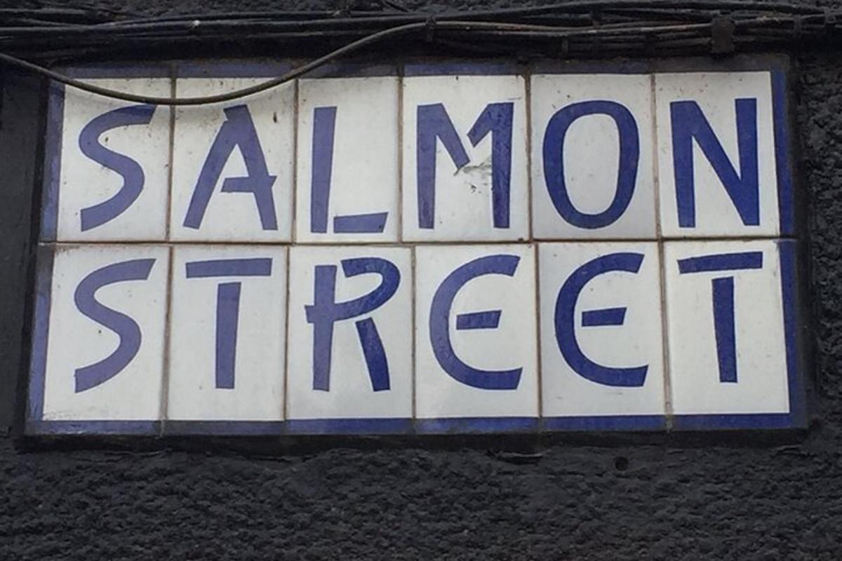 a sign that reads salomon street hanging on a wall