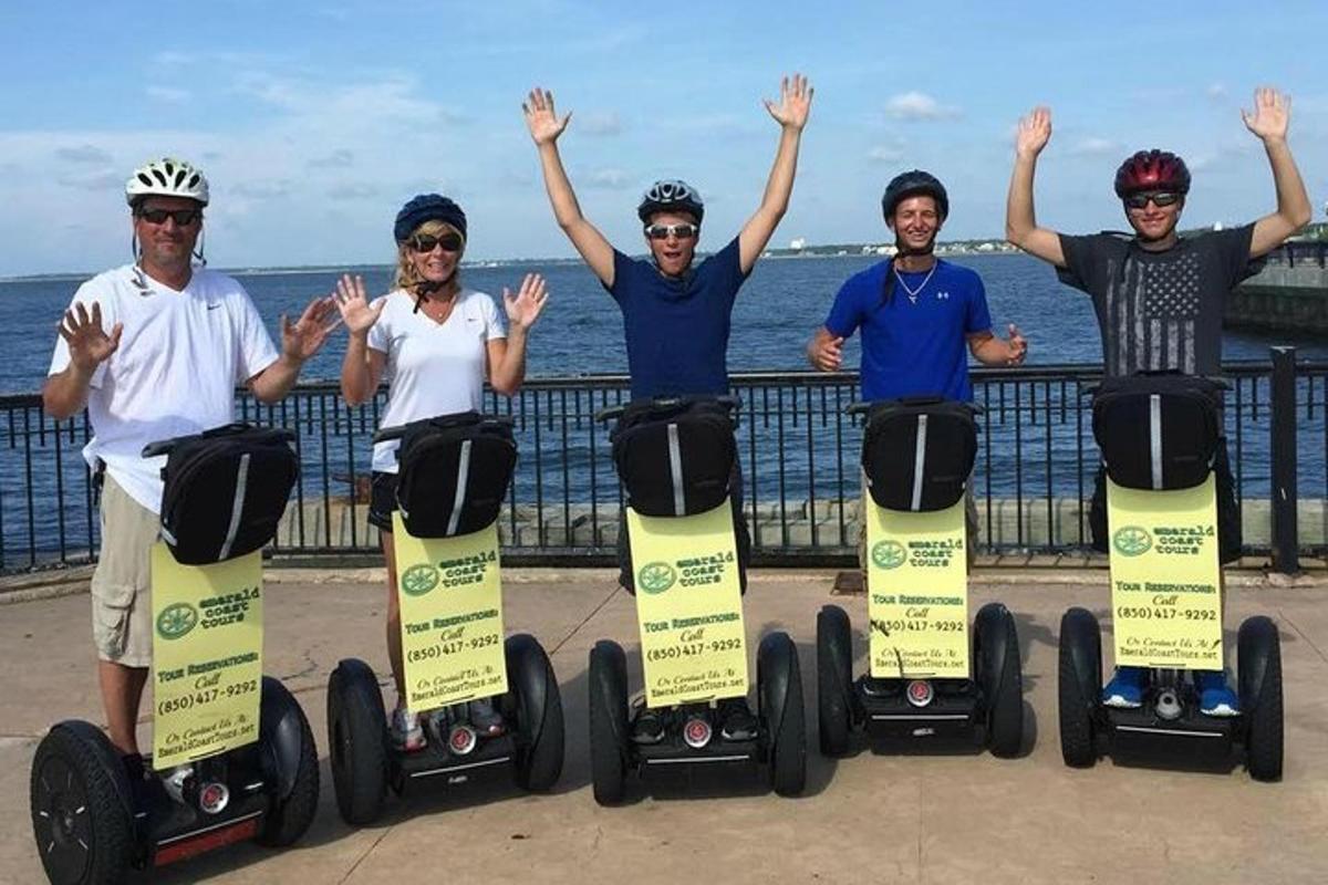 a group of four people riding on segways