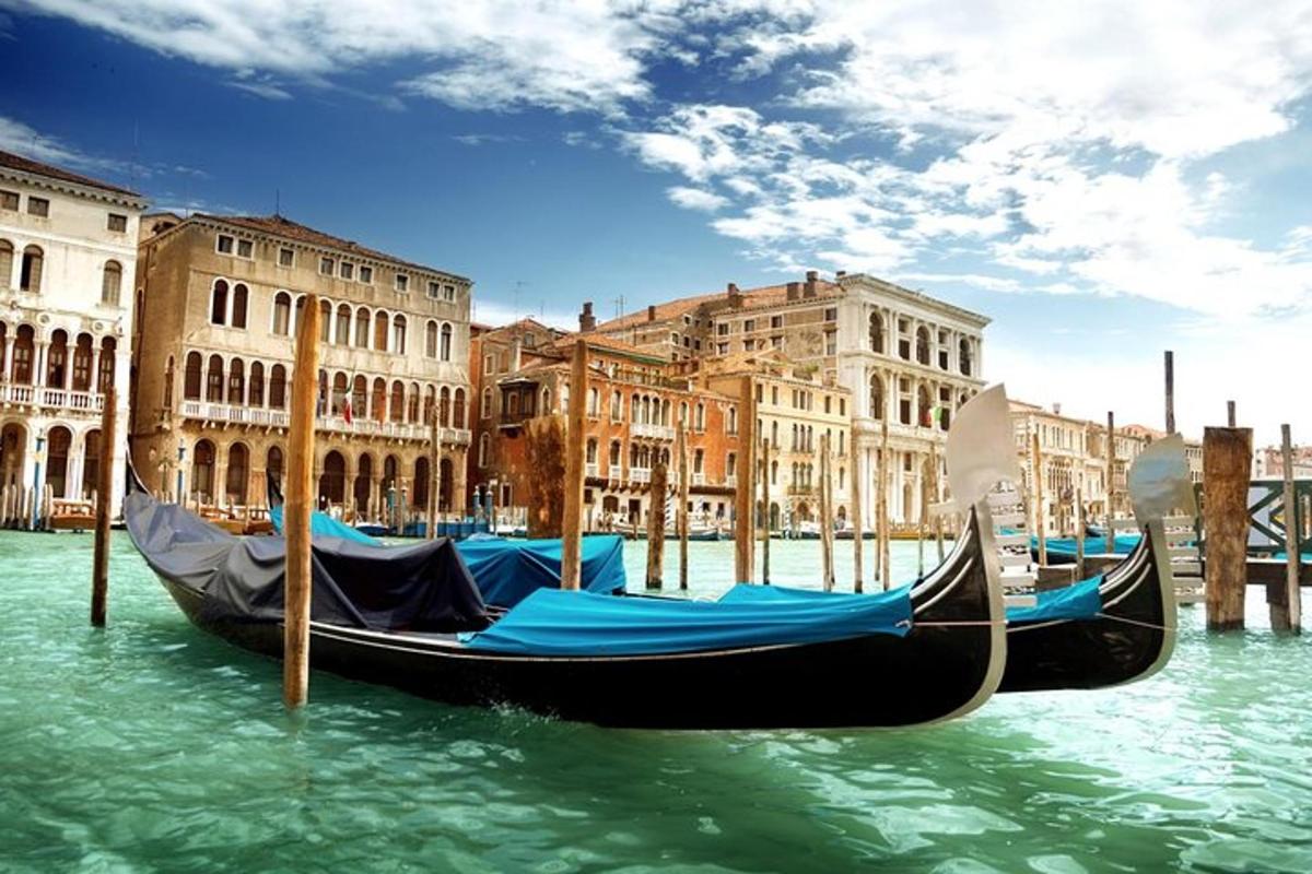 a gondola sitting in the water in front of buildings