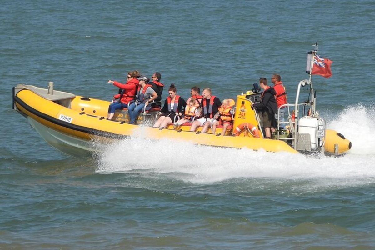 a group of people on a yellow boat in the water