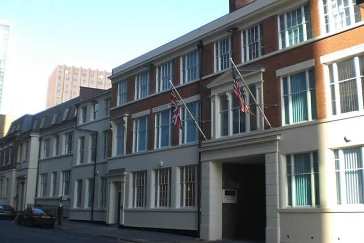 a building with two american flags in front of it