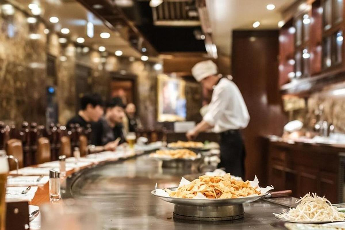 a chef preparing food in a restaurant kitchen