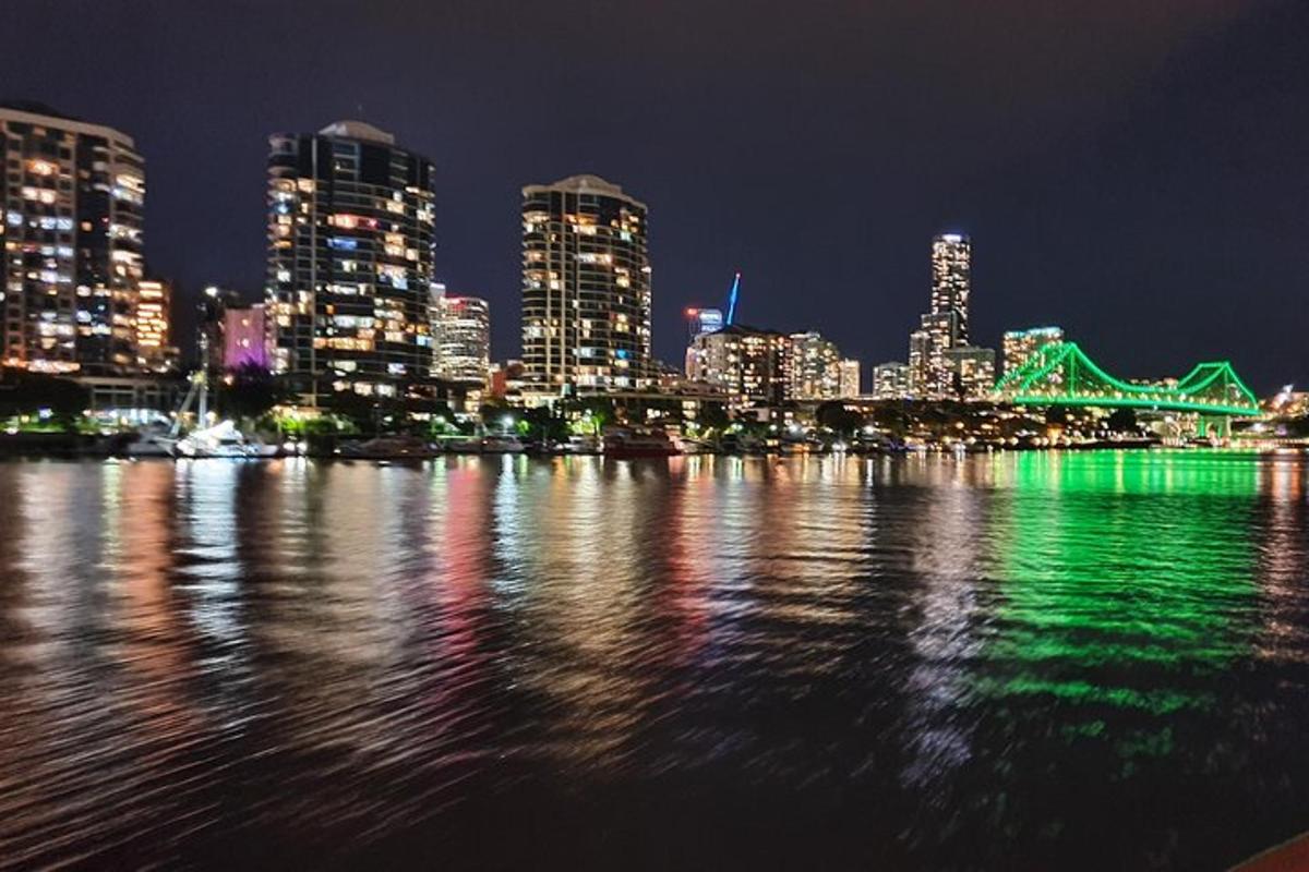 a view of a city at night with the water