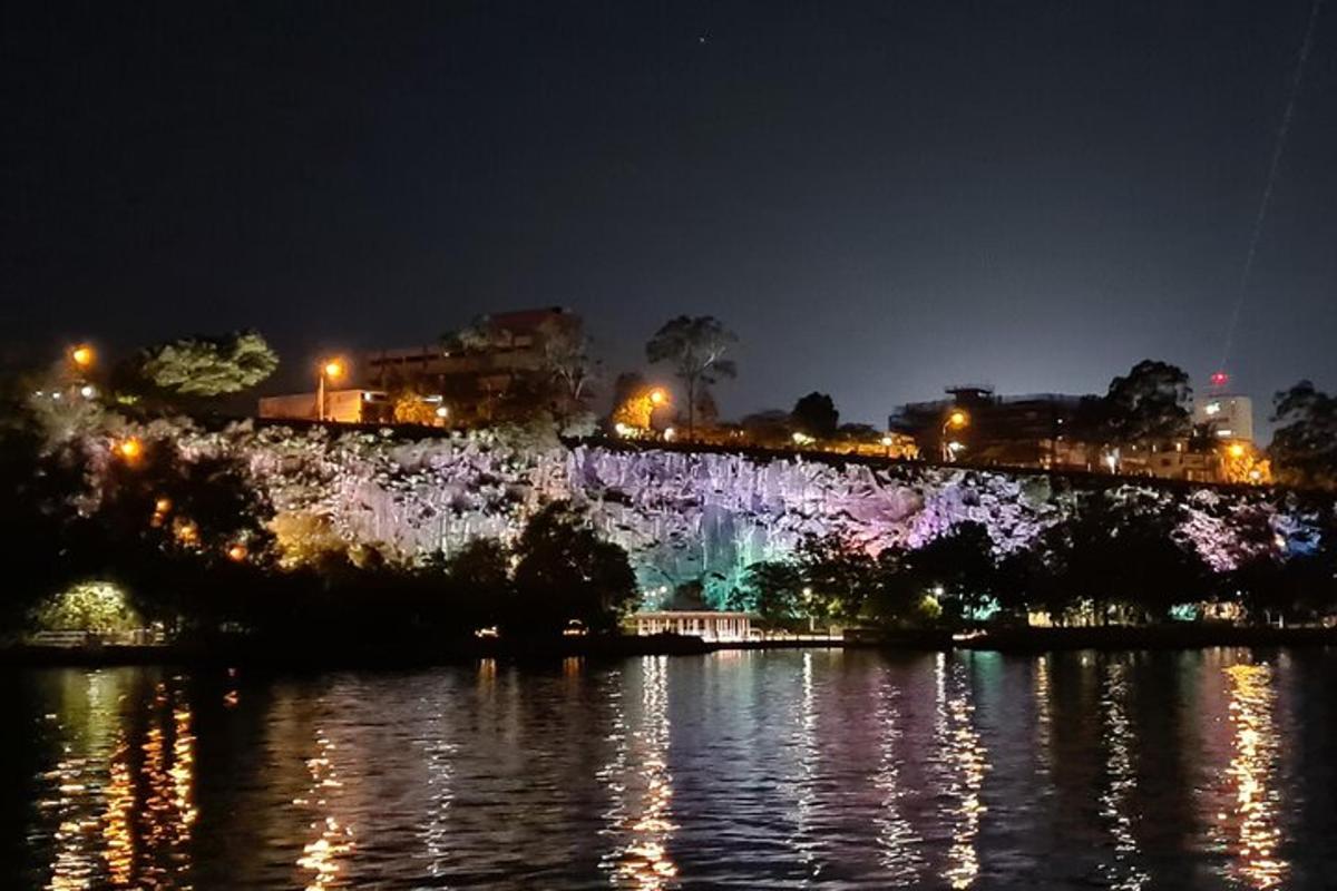 a waterfall in the middle of a river at night